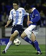 Fan Zhiyi (left) in action for Dundee