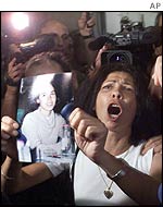 Israeli Brigitte Kesler, holding a picture of her daughter Gili Shara, who was killed by Palestinian militants