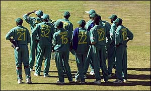 Kenyan players await a decision from the third umpire