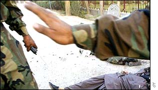 Soldiers waving people away