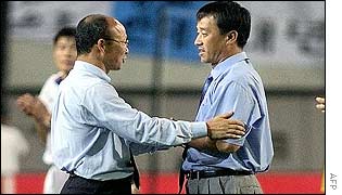 South Korea's head coach, Park Hang-seo, shakes hands with North Korean head coach Ri Jung-man 