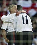 Smith is congratulated by Heskey