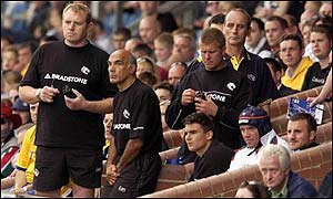 Dean Richards (left) and the Leicester bench look on during the loss against Leeds