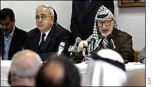 Yasser Arafat (right) addresses his parliament