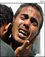Brothers of Jamal Shalouf, one of the Palestinians killed in Gaza on Monday