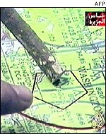 Still from video showing finger pointing to Washington on map
