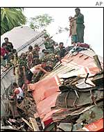 Rescuers amid the wreckage
