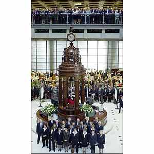The Underwriting Room at Lloyds in London falls silent as the Lutine Bell is rung in