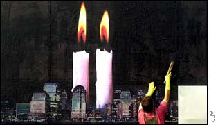 A worker adjusts a memorial in Pristina