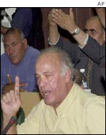 Palestinian parliamentary delegates, including legislator Salah Taameri, front, ask to speak