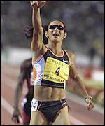 Ana Guevara points to the crowd after winning another Golden League 400m