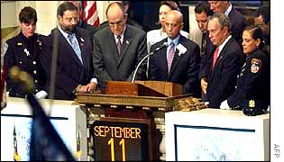 Senior New York officials observe a two minute silence before the start of trade