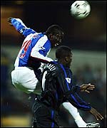 Blackburn's Dwight Yorke (left) clashes with Chelsea's Marcel Desailly