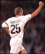 Jamie Wood celebrates after scoring Swansea's second goal against Wolves