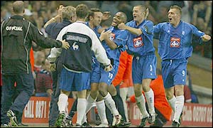 Clinton Morrison (centre) is mobbed after his late equaliser