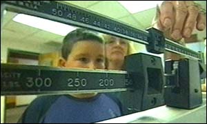 boy being weighed 
