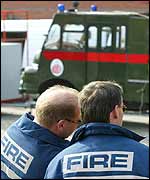 Firefighters demonstrate at conference with Green Goddess fire engine in background