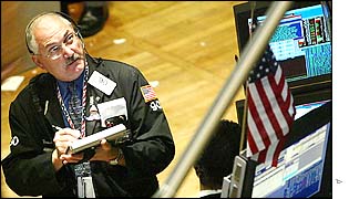 Trader watching stock market board