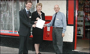 Glenn Chester, Eleanor Burnham and Ron Harrison with their petition