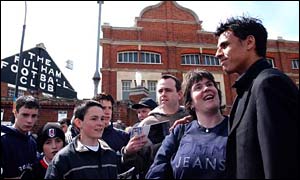 Chris Coleman is greeted by Fulham fans outside Craven Cottage in April