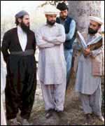 Mullah Krekar (left) with three other men