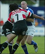 Richard Parks stops Bridgend captain Gareth Thomas in his tracks