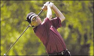 Billy Andrade hits an iron