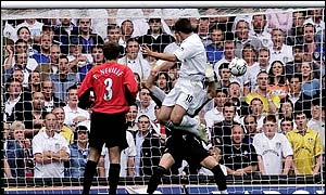 Leeds' Harry Kewell rises heigh to head home the winner