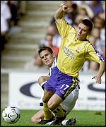 Southampton's Marian Pahars is tackled by Albion's Phil Gilchrist