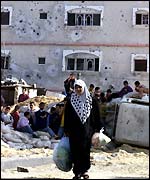 A Palestinian woman near the Gush Qatif settlement 