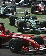 Eddie Irvine cuts across the first chicane at the start of the Italian Grand Prix