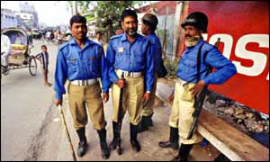 Police standing in street in Bangladesh