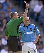 Danny Tiatto is shown the red card for a challenge on David Thompson