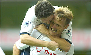 Teddy Sheringham celebrates scoring with Robbie Keane