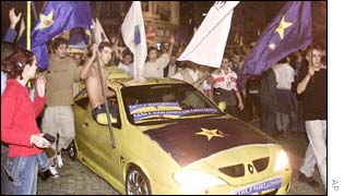 Youngsters celebrate the victory of the opposition coalition in the Macedonian capital Skopje