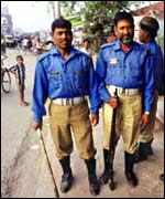 Police standing in street in Bangladesh