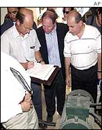 Jim Franckiewicz (left) inspects pumping station