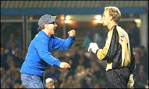 A Birmingham fan goads Villa goalkeeper Peter Enckelman