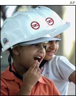Children of metro workers look on in delight