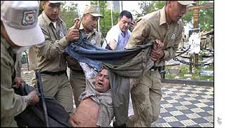 A protester is arrested and dragged away by police 