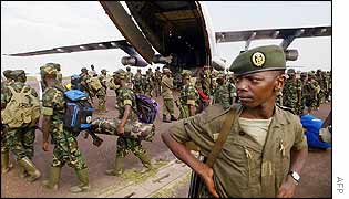 Troops board plane