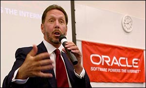 CEO Larry Ellison speaking in front of Oracle banner