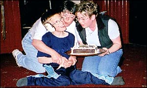 His mother and sister help Stephen celebrate his birthday