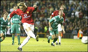 Diego Forlan strikes the ball sweetly from the spot to score his first goal for the club