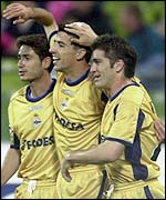 Deportivo la Coruna striker Roy Makaay is congratulated by Sanchez Victor (left) and Hector 