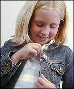 Kidcontact is attached to a girl's jacket