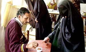 A Kashmiri woman voting at a polling station