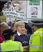 Farmer talking to police at demo