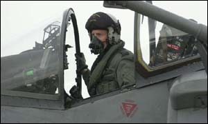 A pilot prepares for take off in his Harrier fighter