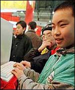 Small boy playing online game